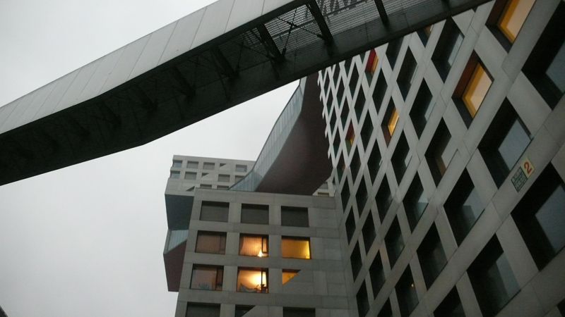 linked hybrid buildings in rain